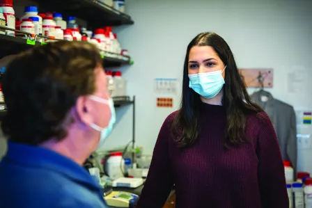 Senior biochemistry major Gaby Smith talks with her mentor, Joe Jez, the Spencer T. Olin Professor, chair of the Department of Biology, and leader of the Ampersand program Biotech Explorers Pathway.