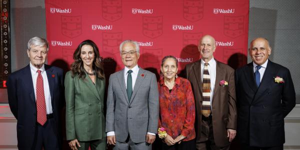 The winners of the 2025 Distinguished Alumni Awards pose for a photo with Dean Hu.