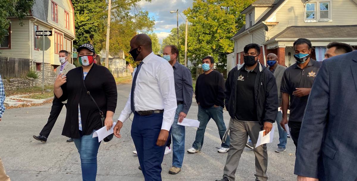 Mayor Quinton Lucas tours the Lykins neighborhood in northeast Kansas City to gather input from residents on crime prevention strategies.