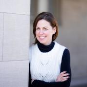 Photo of woman leaning against a wall