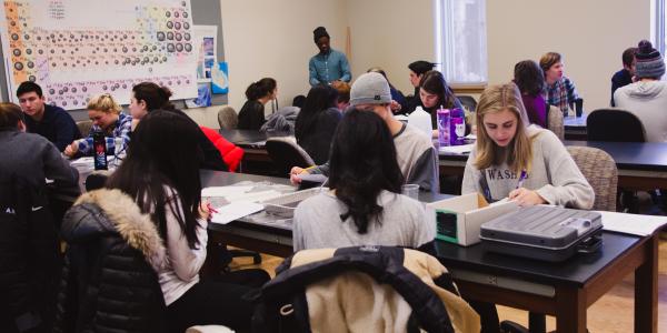 A group of students in an Earth and planetary sciences classroom