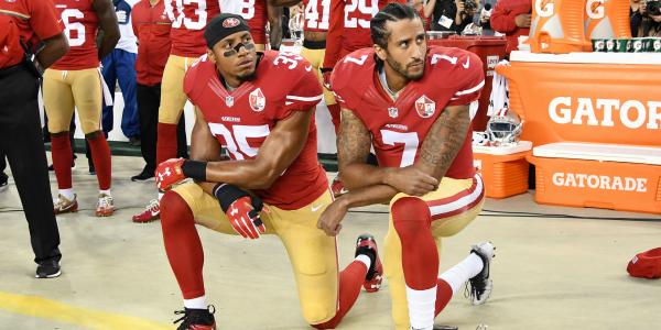 Colin Kaepernick kneeling with a collegue