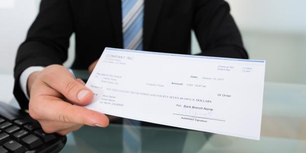 An employee recieves a paycheck