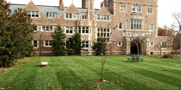 Shot of a gothic style academic building and lawn