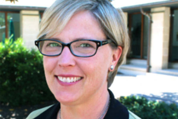 A headshot of Carol Moakley